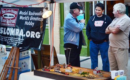 men talking at model layout display